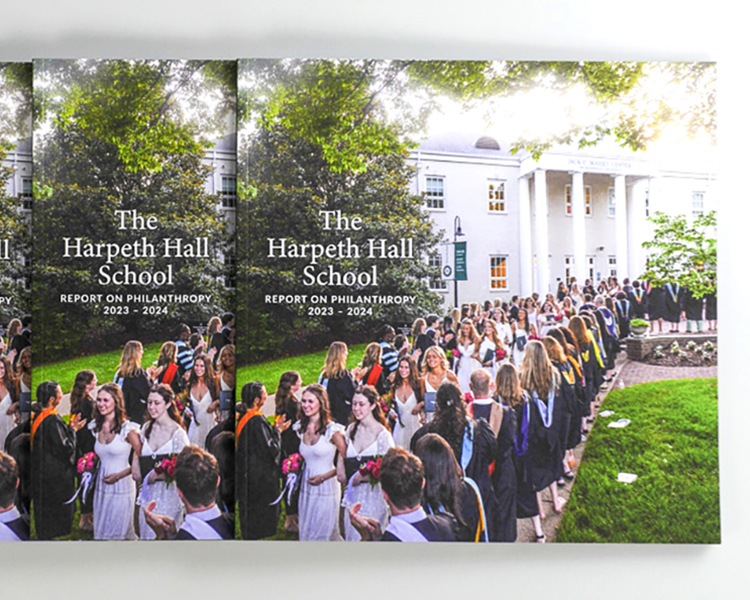 Multiple copies of the Harpeth Hall School annual report mailer displayed together